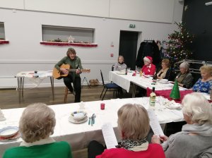 Carol singing with Christine, our President, at our December meeting.